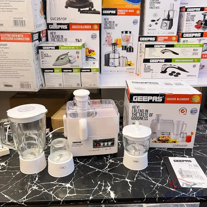 A white multi-function kitchen appliance with a juicer, blender, and grinder attachments.