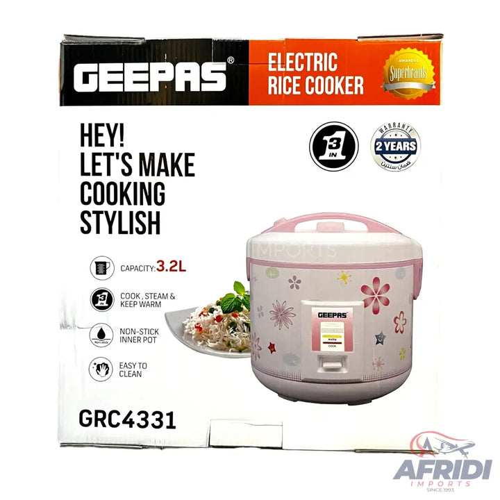 A pink and white electric rice cooker with a floral pattern, 3.2L capacity, non-stick inner pot, and a 2-year warranty.