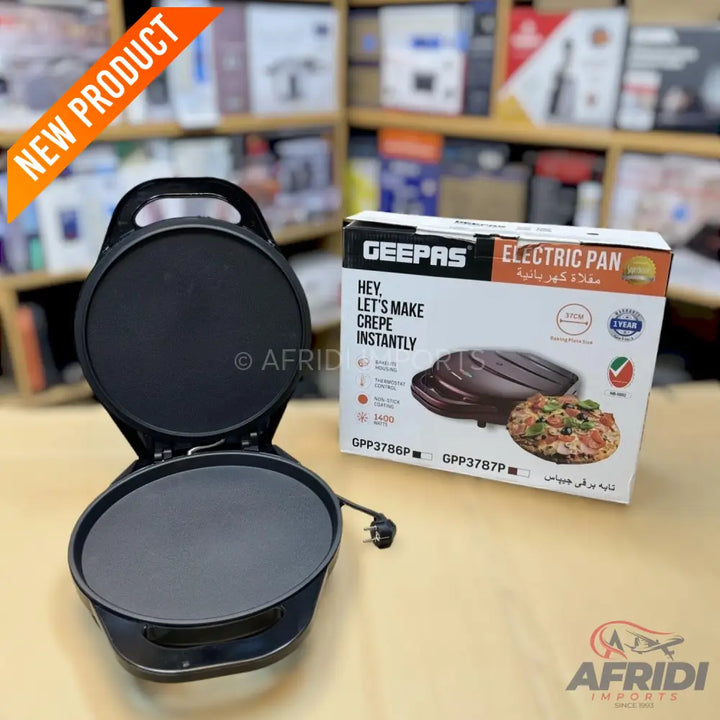 Black electric crepe maker with a non-stick coating and a hinged lid.