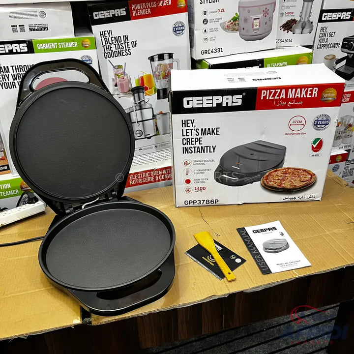 Black electric pizza and crepe maker with an open lid.