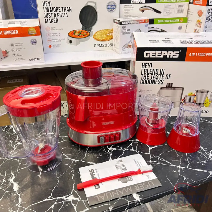 Red multi-function food processor with blender, chopper, and grinder attachments.