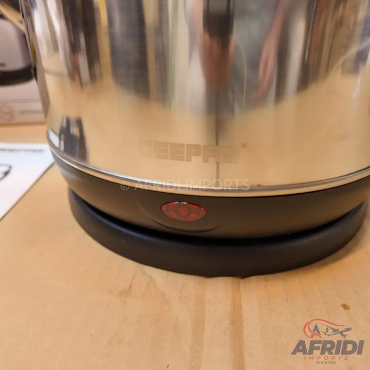 Stainless steel electric kettle with a black base.