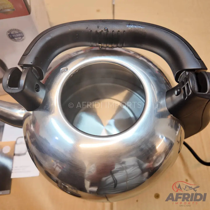 Shiny stainless steel electric kettle with a black handle.