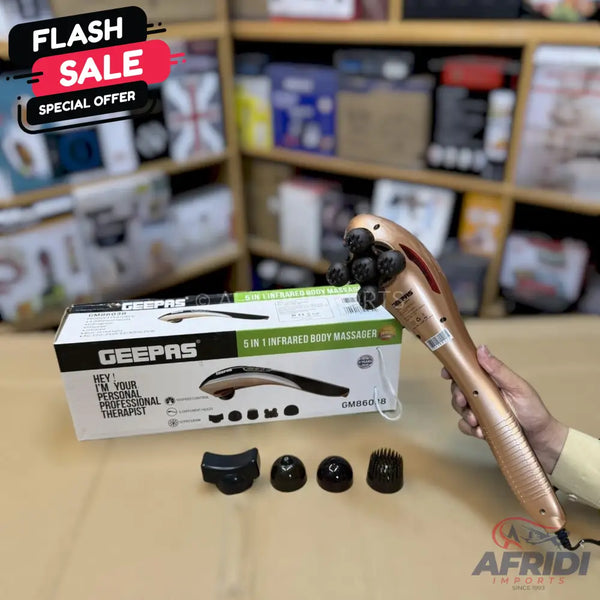 A gold-colored handheld massager with multiple interchangeable heads and infrared functionality.