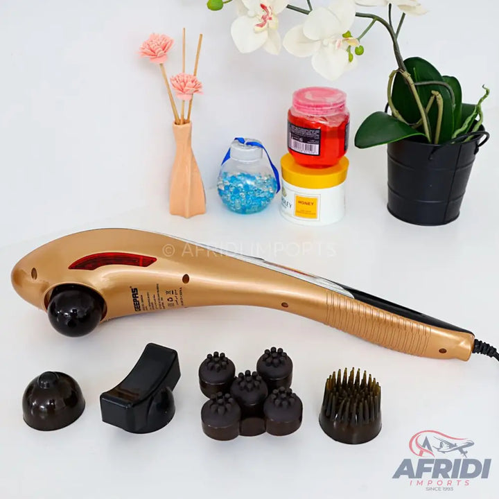 Gold-colored handheld electric massager with interchangeable heads.