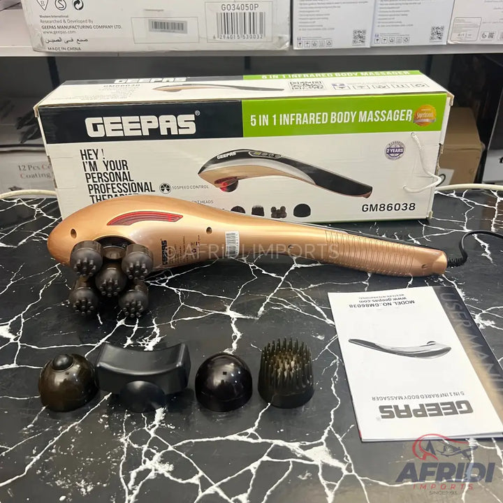 A gold-colored Geepas 5-in-1 infrared body massager with multiple interchangeable massage heads.