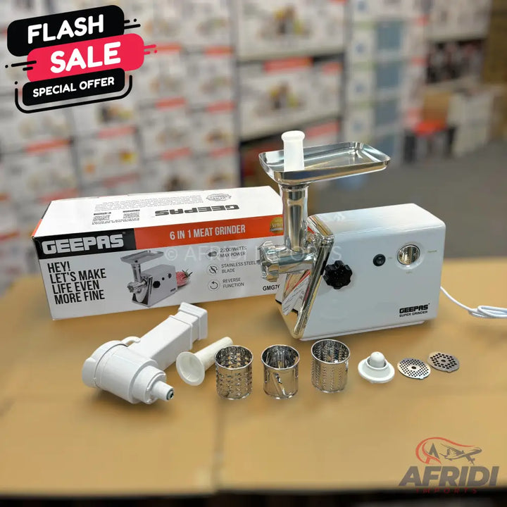 White electric meat grinder with various attachments and its packaging.