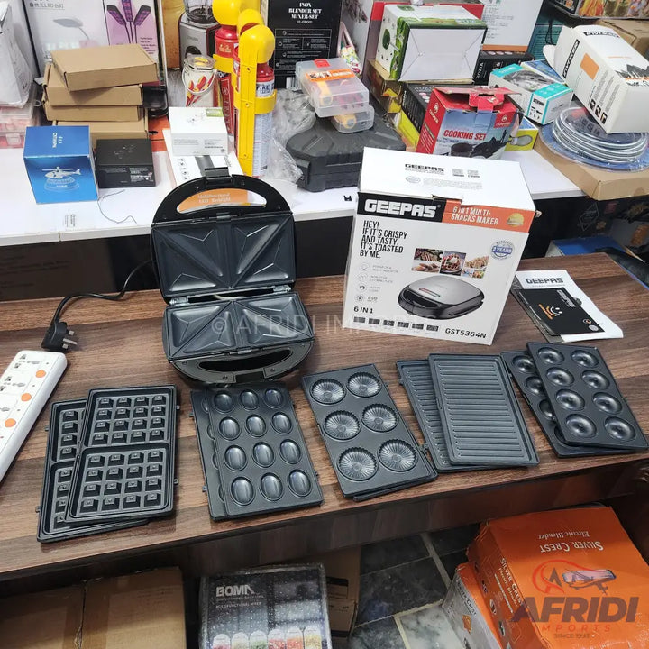 A multi-functional electric sandwich maker with interchangeable plates for waffles, sandwiches, and other snacks.