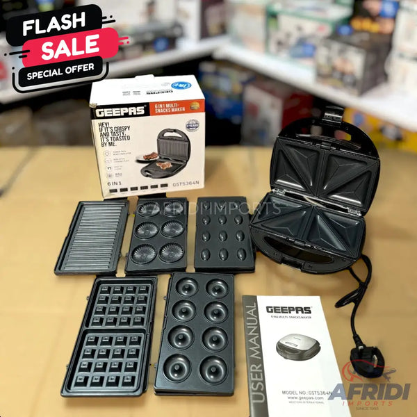 A black 6-in-1 multi-snack maker with interchangeable plates for various treats.