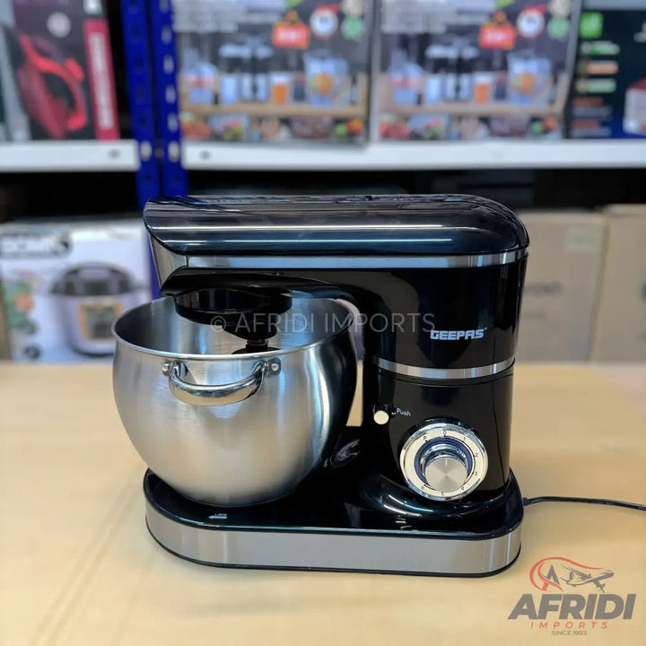Black stand mixer with a stainless steel bowl and silver accents.