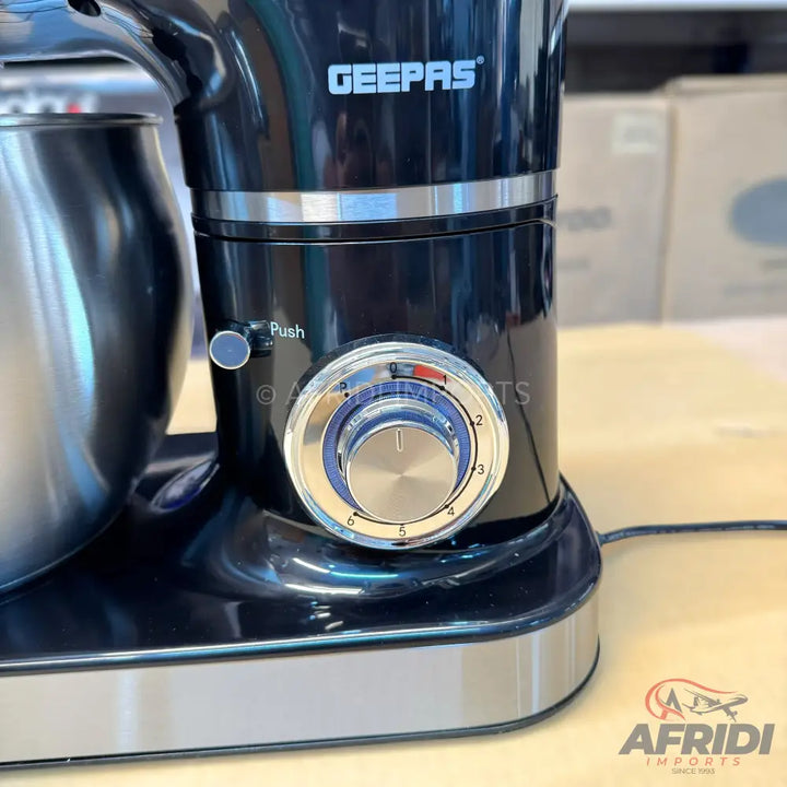 Black stand mixer with a stainless steel bowl and a silver control knob.