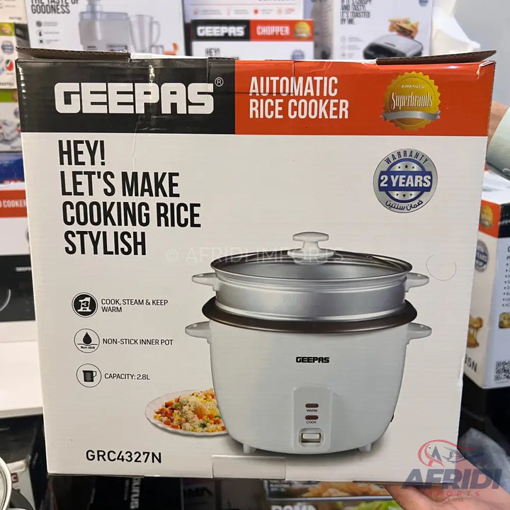 White Geepas automatic rice cooker with a 2.8L capacity, non-stick inner pot, and a 2-year warranty, designed for cooking, steaming, and keeping rice warm.