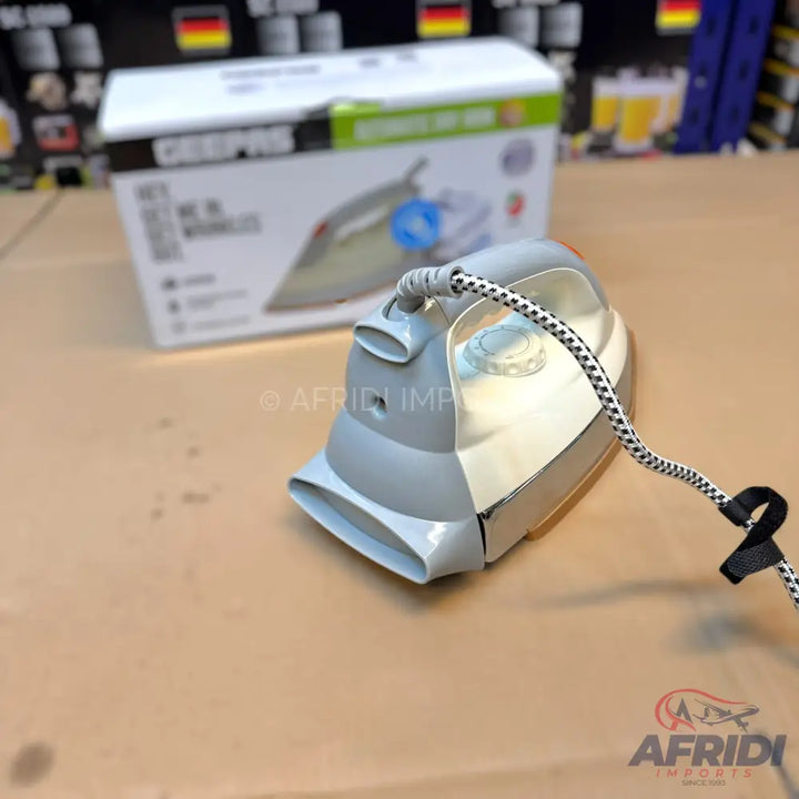 A grey and white electric steam iron with a patterned power cord.