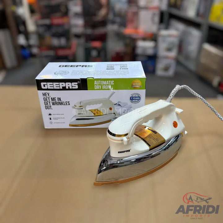 White and gold automatic dry iron with a chrome soleplate.
