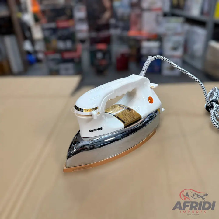 White and gold dry iron with a chrome soleplate and braided power cord.