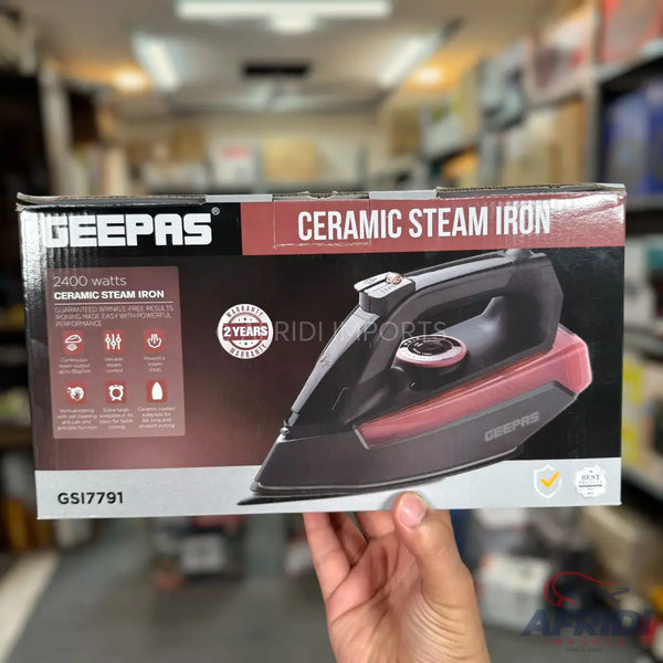 A Geepas 2400-watt ceramic steam iron, model GSI17791, with a 2-year warranty.