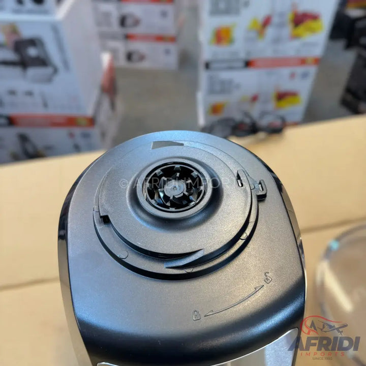The top-down view of a dark grey or black blender base with a central, spoked drive shaft.