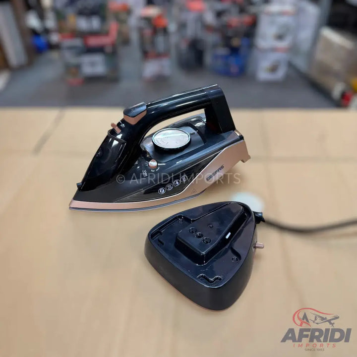 Black and rose gold cordless steam iron with a charging base.