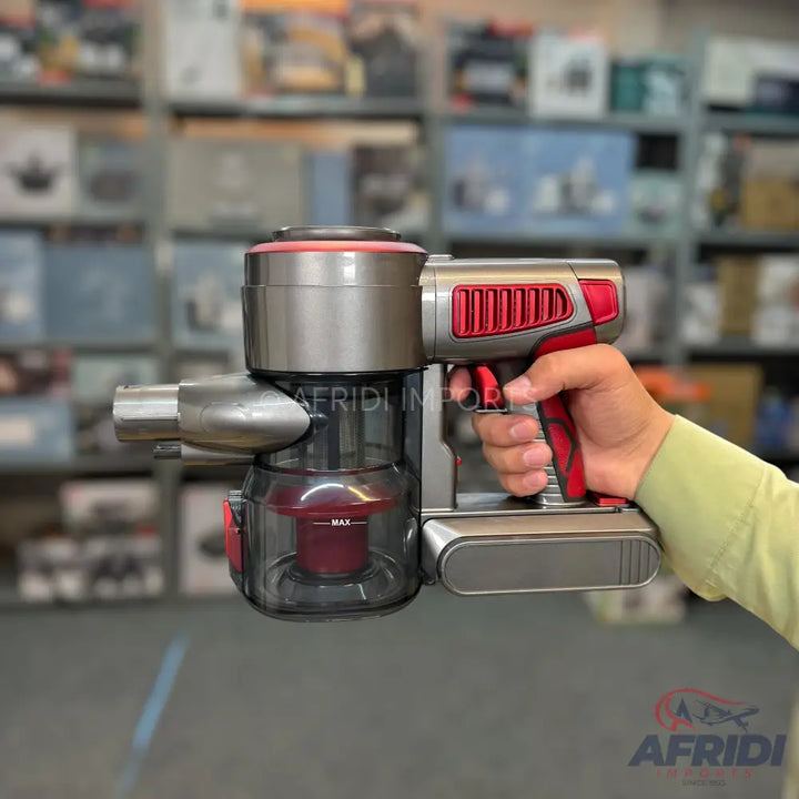 Handheld cordless vacuum cleaner with a grey and red design.