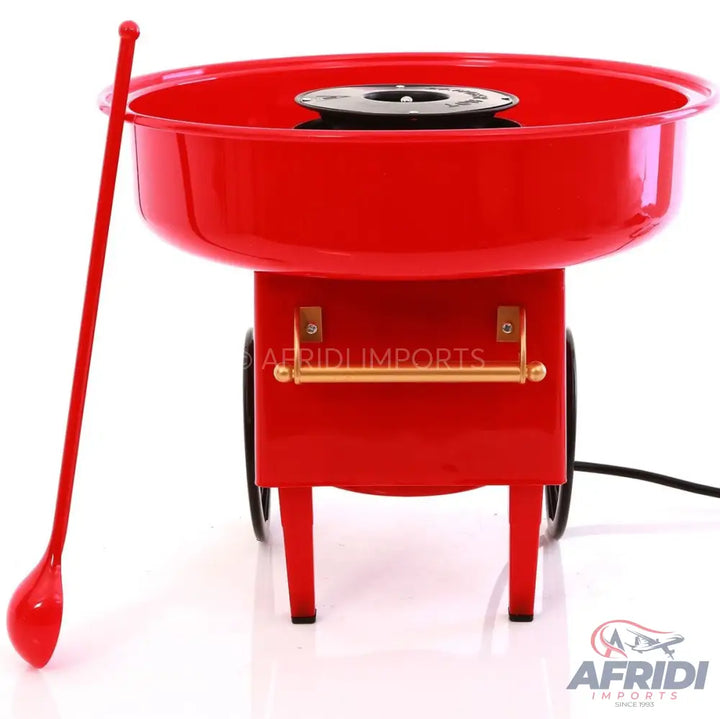 Red electric cotton candy machine with a spoon.