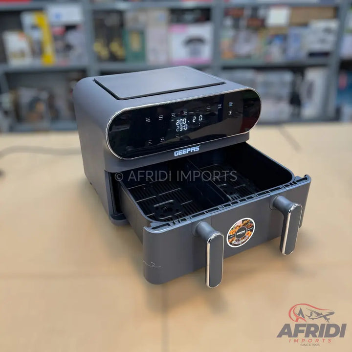 Dark gray digital air fryer with two pull-out baskets.