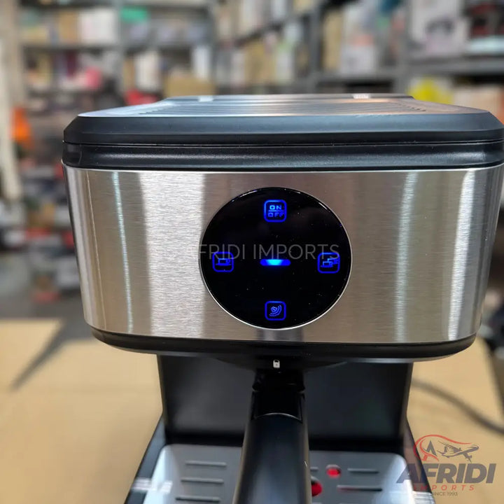 Stainless steel espresso machine with an illuminated control panel.