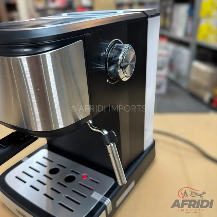 A black and stainless steel espresso machine with a steaming wand and drip tray.
