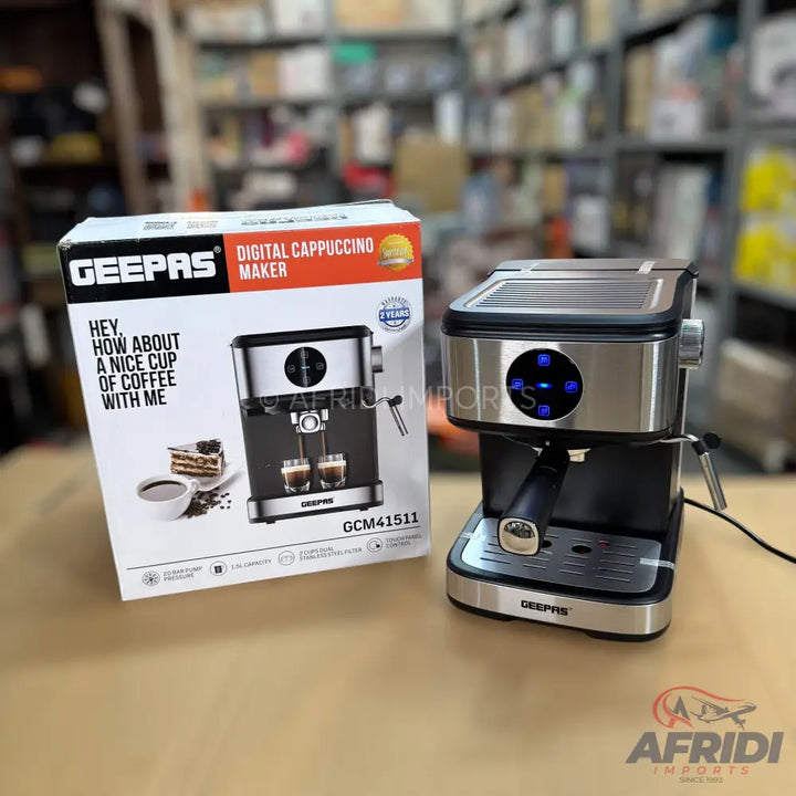A stainless steel and black espresso machine with a digital display and a boxed version of the product.