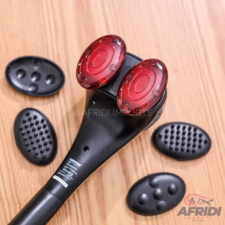 Black handheld massager with interchangeable heads and red infrared lights.