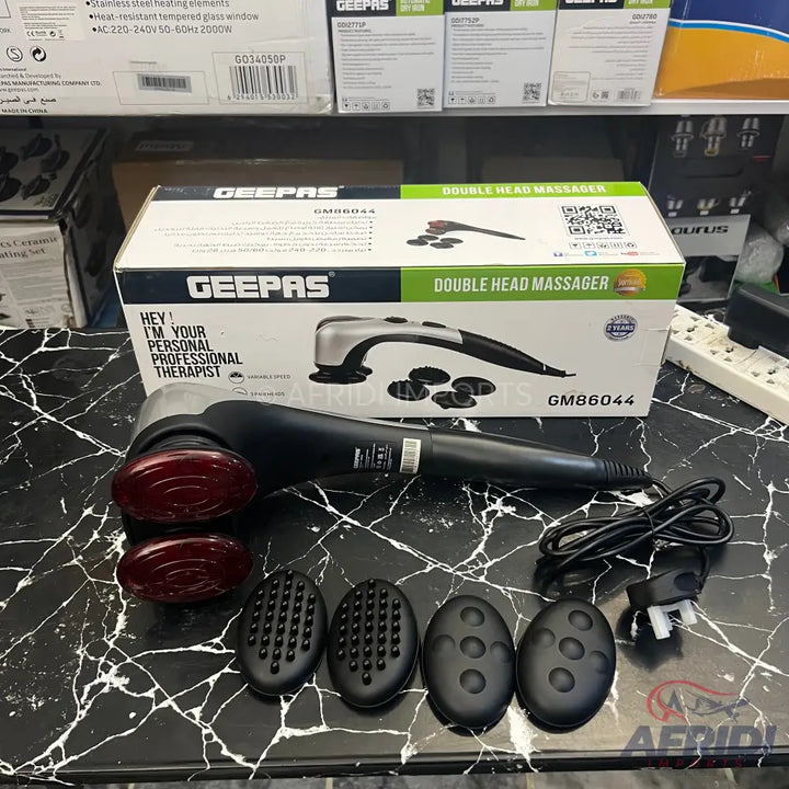 Black and silver double-head massager with interchangeable massage heads and power cord.