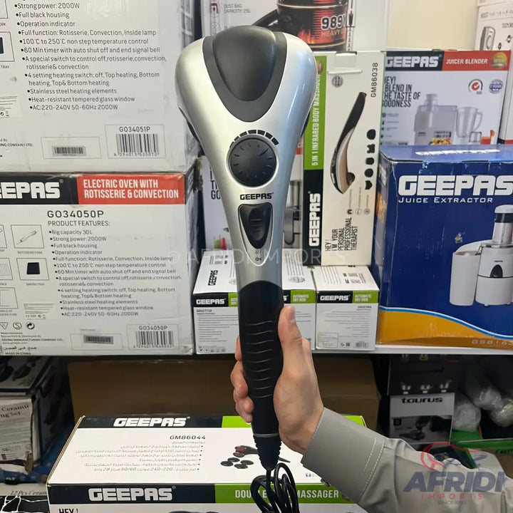 Silver and black handheld electric massager with a power cord.