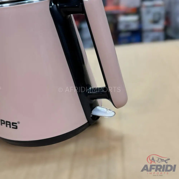 A pale pink electric kettle with a black handle and base.