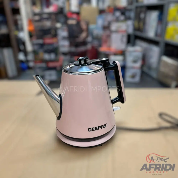 Pink electric kettle with a silver spout and lid.