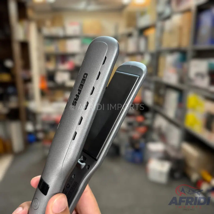 A sleek, grey hair straightener with black ceramic plates.