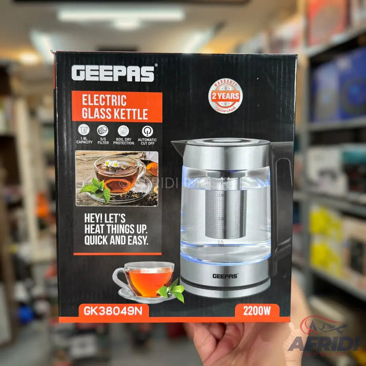A Geepas electric glass kettle with a 1.8L capacity, filter, boil-dry protection, and automatic cut-off, featuring a 2-year warranty and 2200W power.