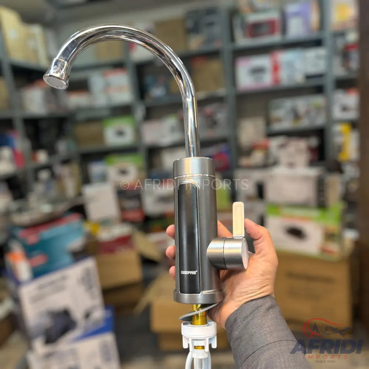 A shiny, curved chrome faucet with a brushed metal base and a single lever handle.