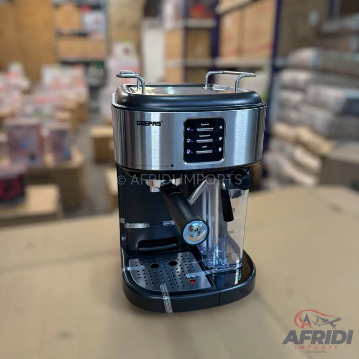 Stainless steel and black espresso machine with an integrated milk frother.
