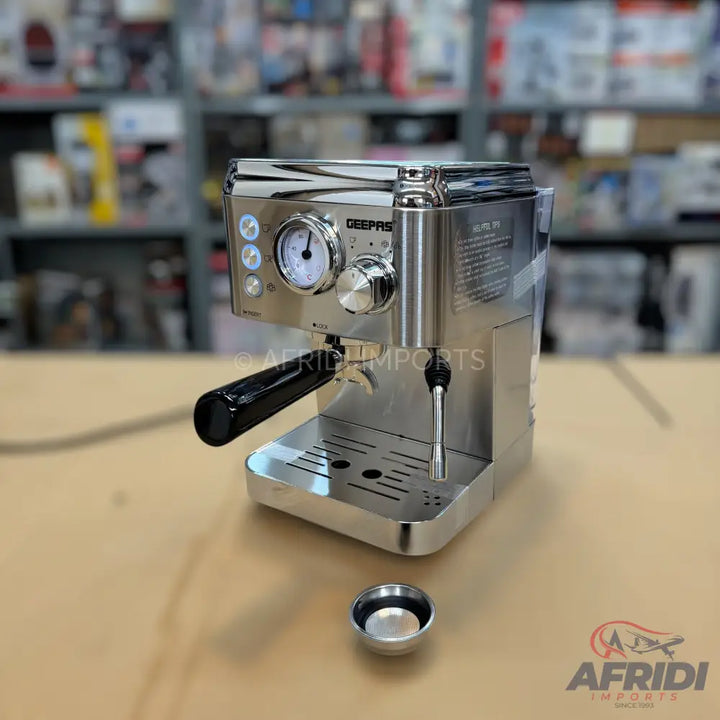 Stainless steel espresso machine with a pressure gauge and steam wand.