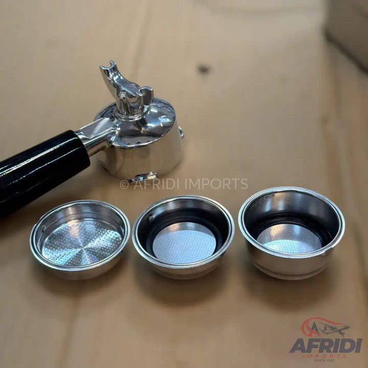 A chrome-plated bottomless portafilter with three different filter baskets.
