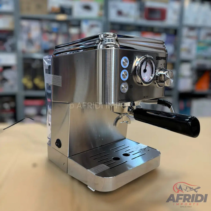 Stainless steel espresso machine with a portafilter and pressure gauge.