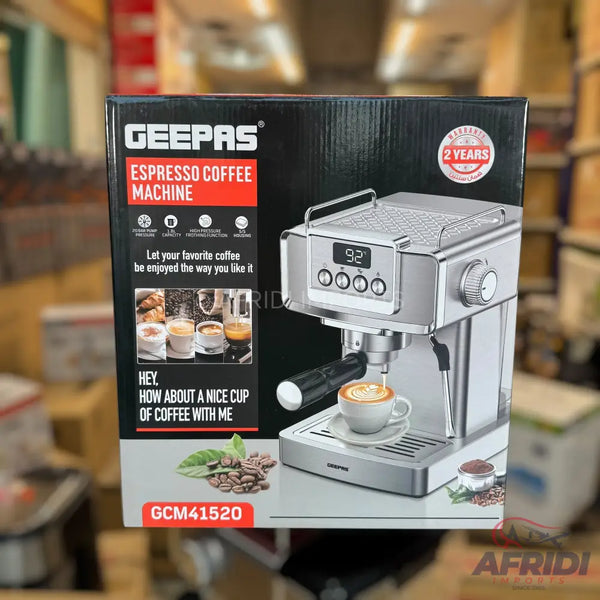 Silver espresso coffee machine with a digital display and frothing wand.
