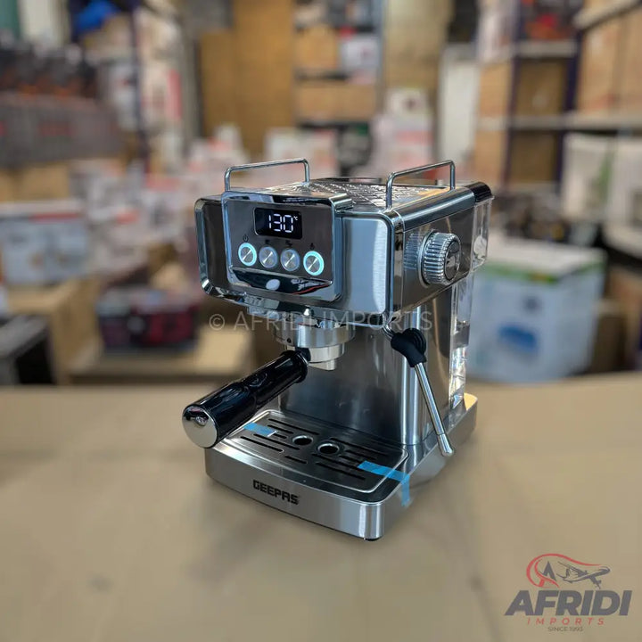 Stainless steel espresso machine with digital display and four control buttons.