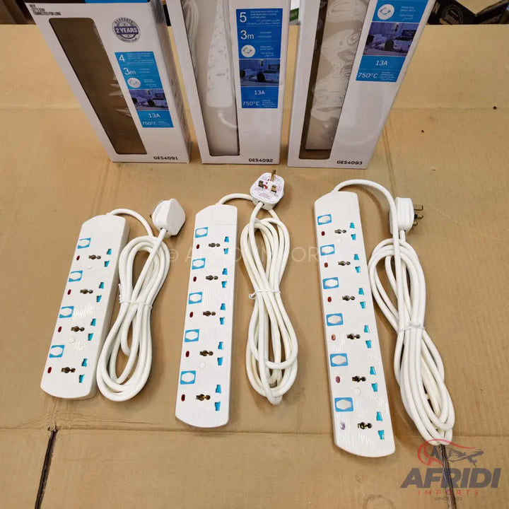 White multi-socket power strips with coiled cords and UK-style plugs.