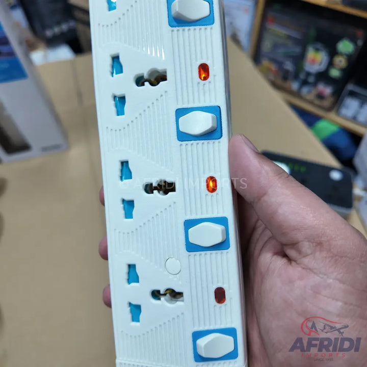 A white power strip with multiple universal outlets, individual switches, and indicator lights.