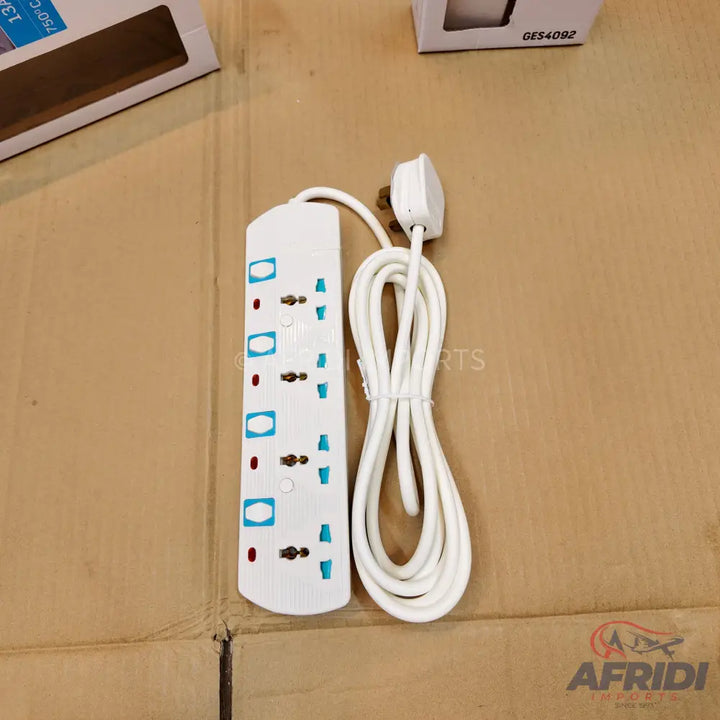 White power strip with multiple universal outlets and a long coiled cord.