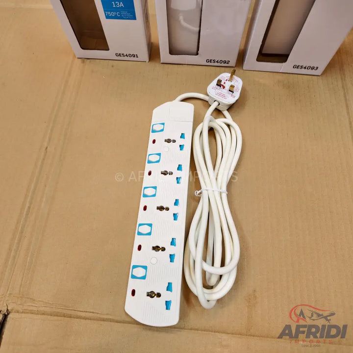 A white power strip with multiple universal outlets, individual switches, and a UK-style plug.
