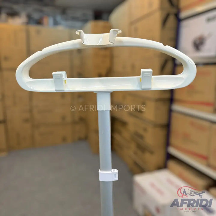 White plastic clothes hanger stand with adjustable height.