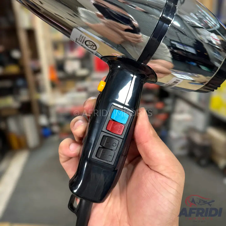 Black and chrome hair dryer with colored control buttons.