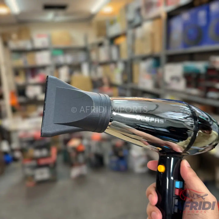 Chrome-plated hair dryer with a black handle and nozzle.