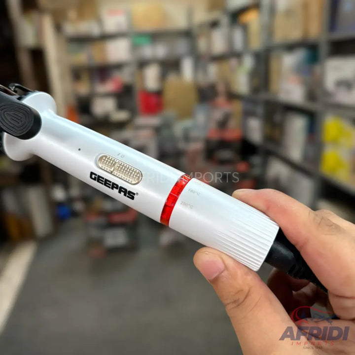 White Geepas handheld immersion blender with a red ring and a textured grip.